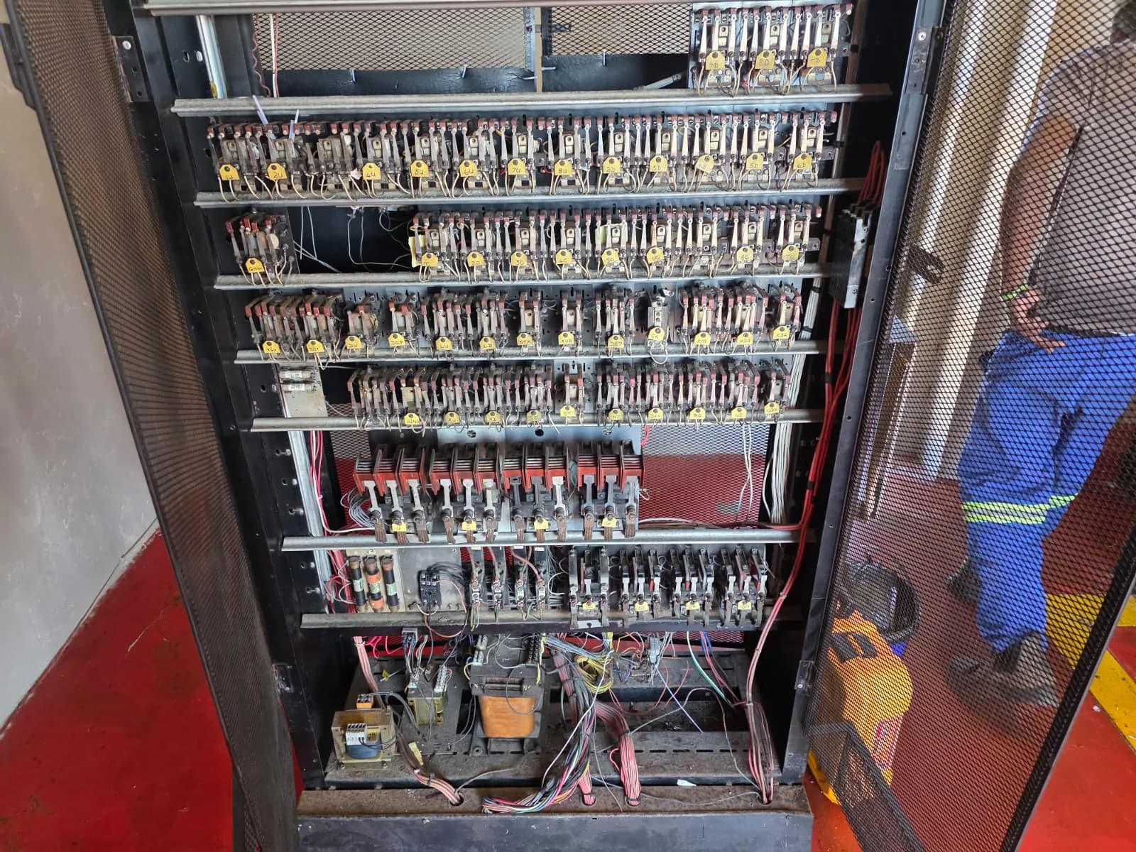 An older relay-style elevator control panel.